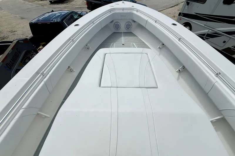Slide: The Image of 2023 Contender 39 Fisharound boat deck with white seating and sleek design. - 18