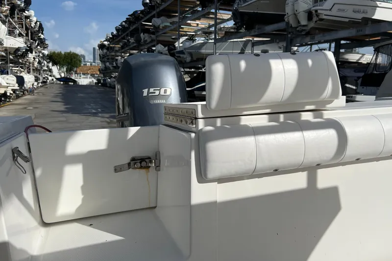 Slide: The Image of 2012 Regulator 24 Forward Seating boat with Yamaha 150 engine in marina storage. - 13