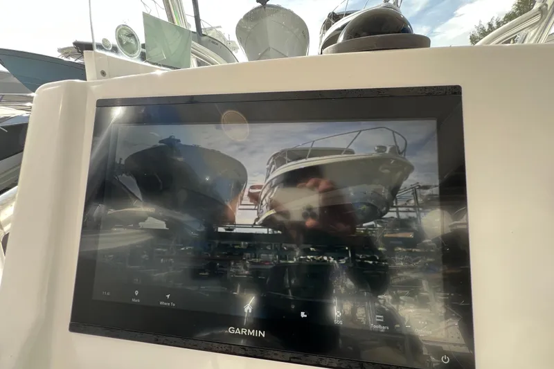 Slide: The Image of Garmin display on 2012 Regulator 24 Forward Seating boat, showing docked vessels. - 17