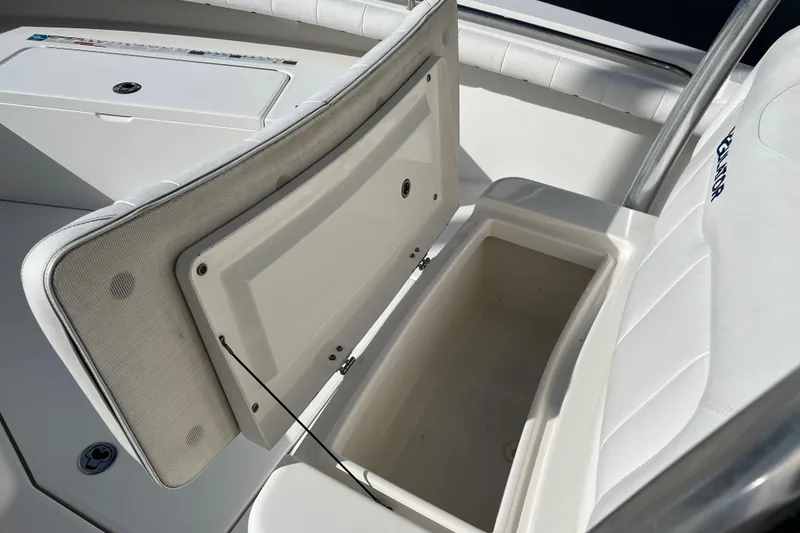 Slide: The Image of 2012 Regulator 24 Forward Seating boat with open storage compartment. - 31