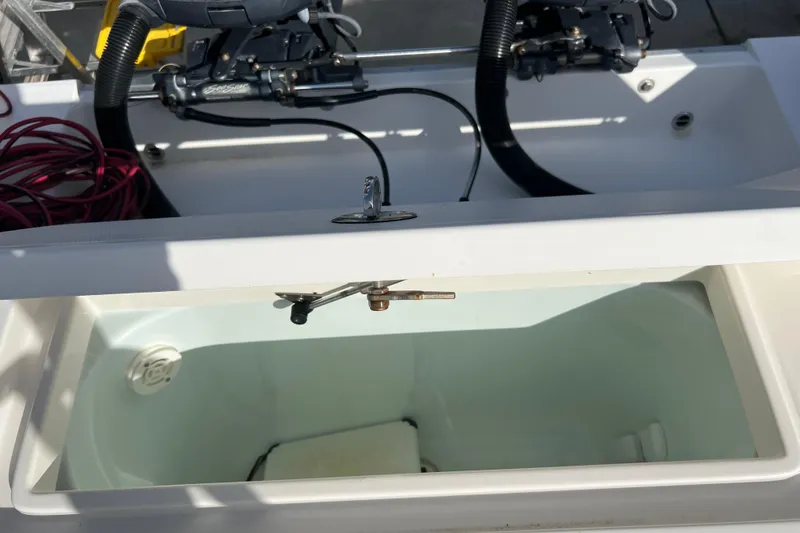 Slide: The Image of 2012 Regulator 24 Forward Seating boat with open storage compartment. - 33