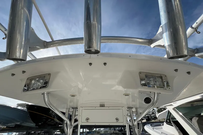 Slide: The Image of 2012 Regulator 24 Forward Seating boat with stainless steel fixtures and overhead lighting. - 38