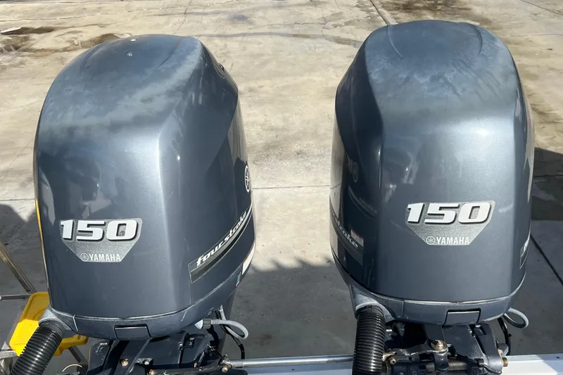 Slide: The Image of Twin Yamaha 150 outboard motors on a 2012 Regulator 24 Forward Seating boat. - 40
