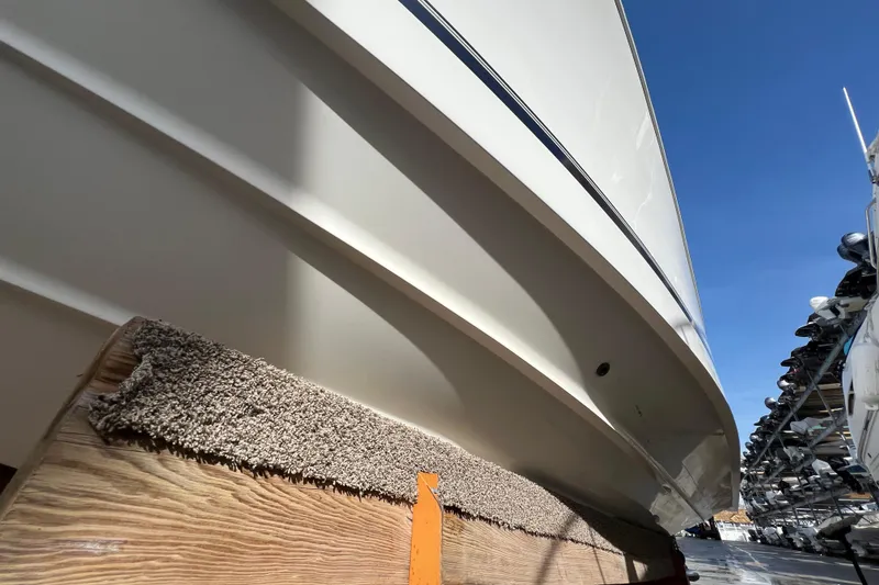 Slide: The Image of 2012 Regulator 24 Forward Seating boat hull on dry dock, clear blue sky. - 41