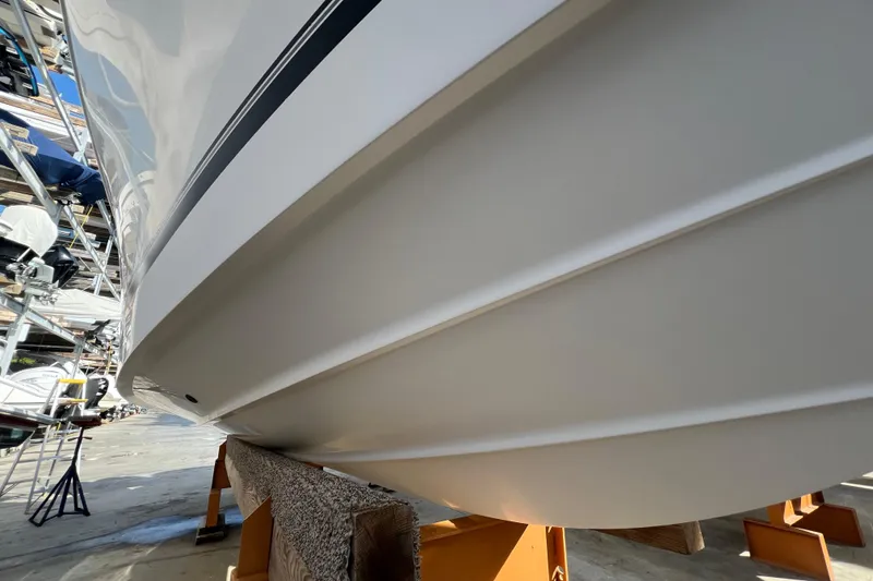 Slide: The Image of 2012 Regulator 24 Forward Seating boat hull on dry dock, side view. - 43