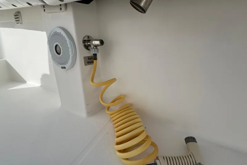 Slide: The Image of 2012 Regulator 24 Forward Seating boat with saltwater hose and speaker. - 45
