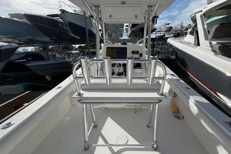Slide: The Image of 2012 Regulator 24 Forward Seating boat interior with helm and seating area. - 8