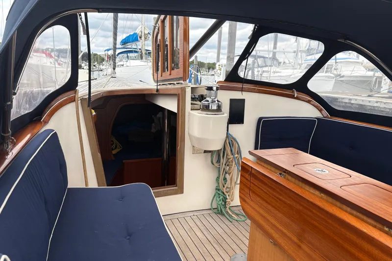 Slide: The Image of Interior view of 2017 Leonardo Eagle 44 sailboat with wooden and navy blue seating. - 11