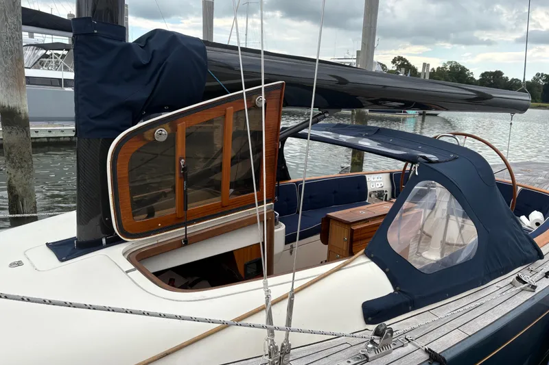Slide: The Image of Sailboat Leonardo Eagle 44, 2017 model, docked with wooden cabin and blue canopy. - 12