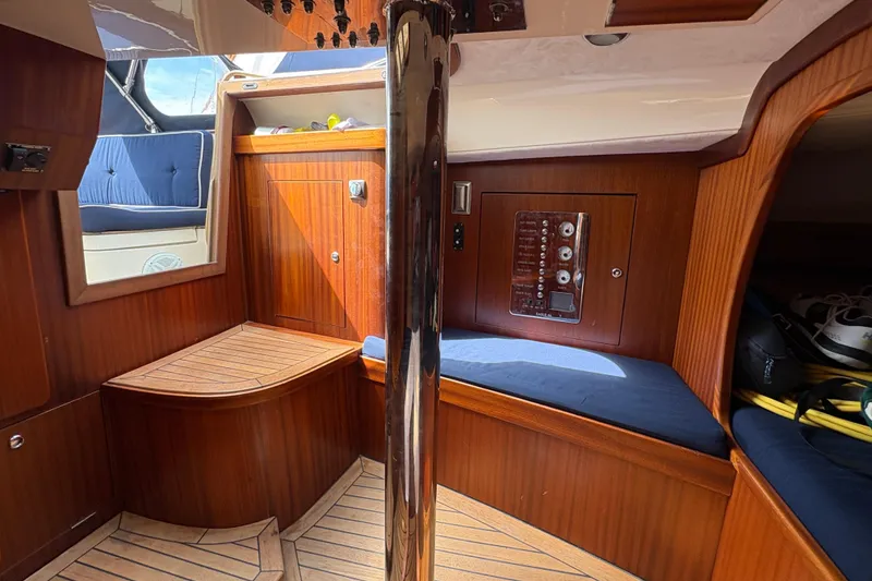 Slide: The Image of Interior of 2017 Leonardo Eagle 44 yacht with wooden paneling and blue seating. - 17