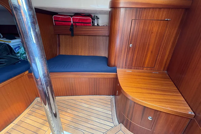 Slide: The Image of Interior of 2017 Leonardo Eagle 44 yacht with wooden finish and blue cushions. - 19
