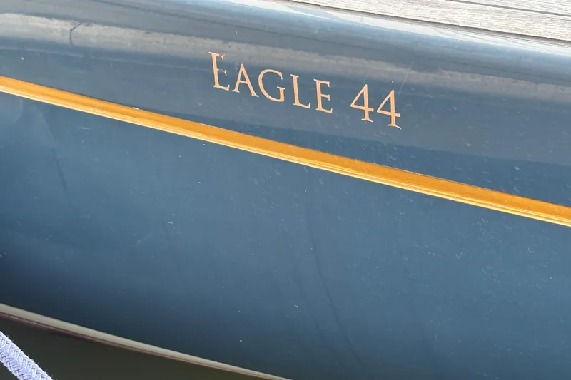 Slide: The Image of Blue hull of 2017 Leonardo Eagle 44 sailboat with gold lettering. - 28