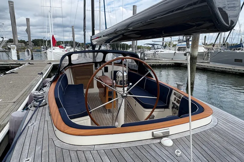 Slide: The Image of Luxurious 2017 Leonardo Eagle 44 yacht docked at marina, featuring elegant wooden deck and spacious cockpit. - 8