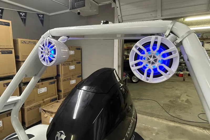 Slide: The Image of Highfield Sport 390 boat with illuminated speakers, showcasing modern design and technology, 2025 model. - 12