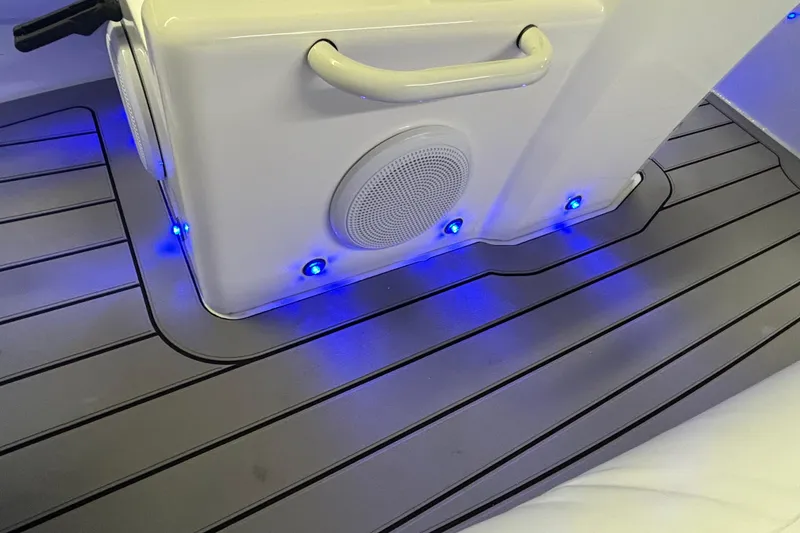 Slide: The Image of 2025 Highfield Sport 390 boat interior with blue LED lights and speaker system. - 15