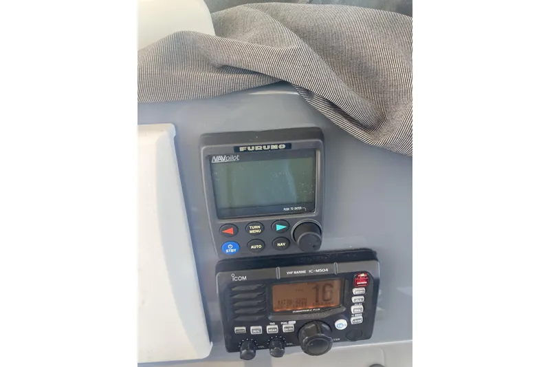 Slide: The Image of Boat navigation and communication equipment on a 2014 Pursuit ST 310 Sport. - 16