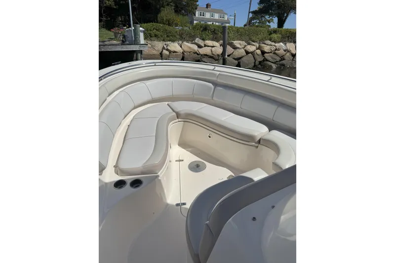 Slide: The Image of 2014 Pursuit ST 310 Sport boat with spacious seating and cup holders. - 4
