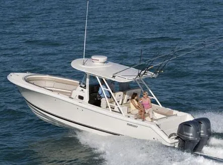 Slide: The Image of Manufacturer Provided Image: 2014 Pursuit ST 310 Sport boat cruising on the ocean. - 8