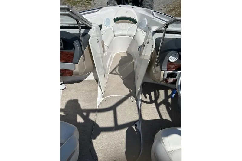 Slide: The Image of Interior of 2006 Four Winns H210 boat with beige seating and carpet. - 10