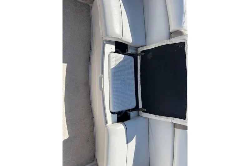 Slide: The Image of 2006 Four Winns H210 boat seat with built-in cooler compartment. - 15
