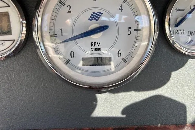 Slide: The Image of RPM gauge of a 2006 Four Winns H210 boat, showing 1.4 x 1000 RPM. - 18