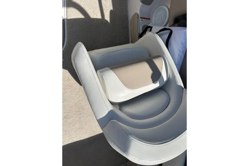 Slide: The Image of 2006 Four Winns H210 boat seat with beige and gray upholstery. - 20