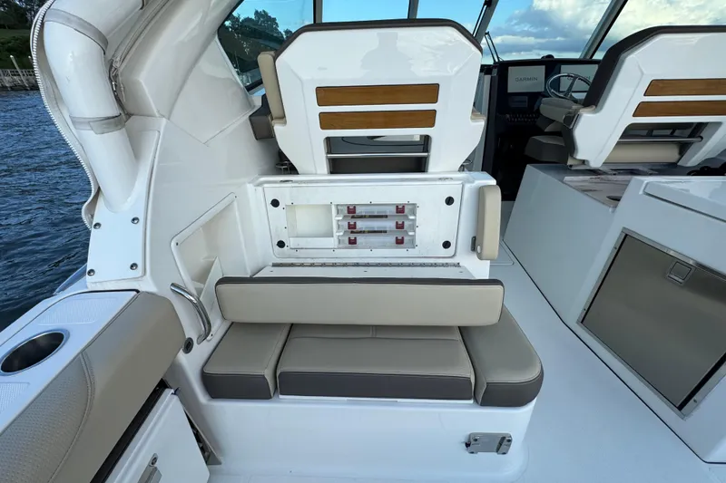 Slide: The Image of 2021 Pursuit DC 326 Dual Console interior with seating and control panel. - 17