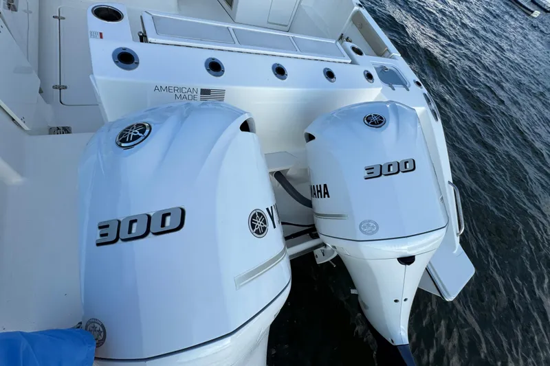 Slide: The Image of 2021 Pursuit DC 326 Dual Console with twin Yamaha 300 engines on water. - 18