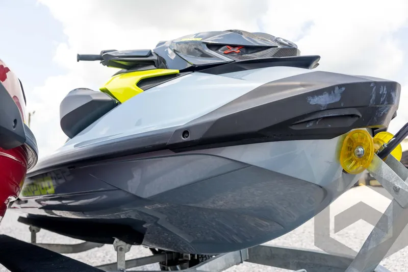 Slide: The Image of 2024 Sea-Doo RXP-X 325 jet ski on trailer, showcasing sleek design and vibrant colors. - 11