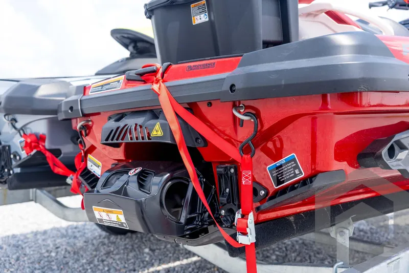 Slide: The Image of 2024 Sea-Doo RXP-X 325 storage compartment with open lid and visible controls. - 13