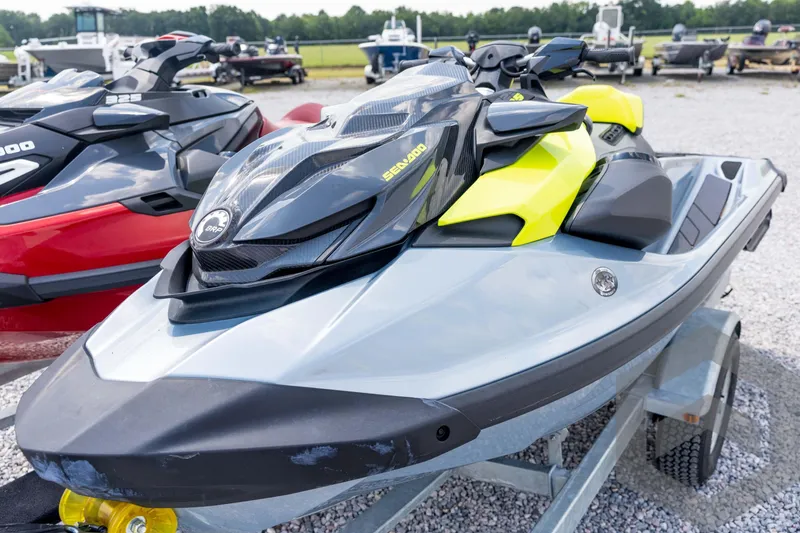 Slide: The Image of 2024 Sea-Doo RXP-X 325 jet ski on trailer, vibrant yellow and gray design. - 19
