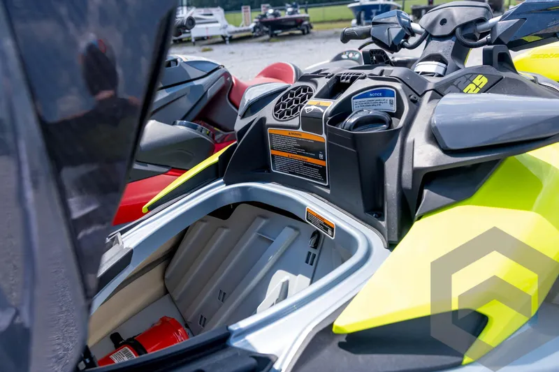 Slide: The Image of 2024 Sea-Doo RXP-X 325 jet ski with open storage compartment, showcasing interior features. - 23