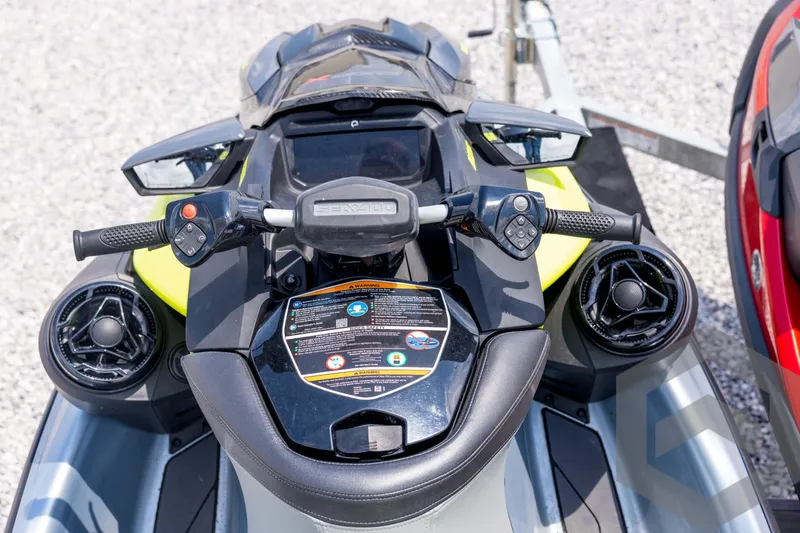 Slide: The Image of 2024 Sea-Doo RXP-X 325 jet ski dashboard with controls and speakers. - 26