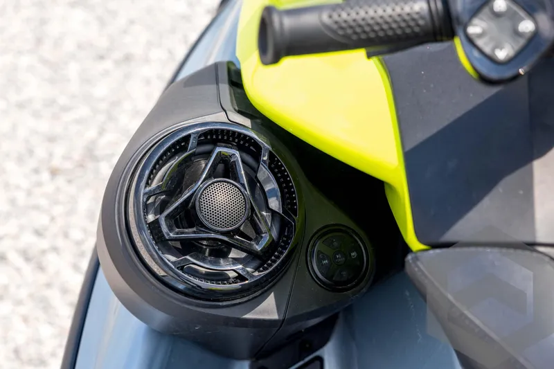 Slide: The Image of Close-up of 2024 Sea-Doo RXP-X 325 handlebar and speaker system. - 27