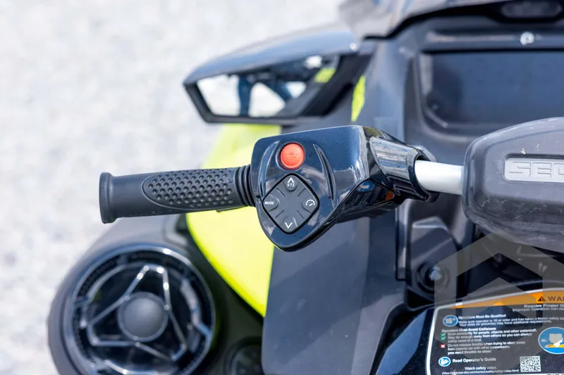 Slide: The Image of 2024 Sea-Doo RXP-X 325 handlebar controls with buttons and grip detail. - 29