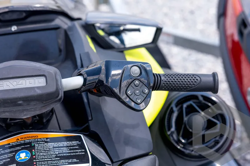 Slide: The Image of 2024 Sea-Doo RXP-X 325 handlebar controls with textured grip and control buttons. - 30