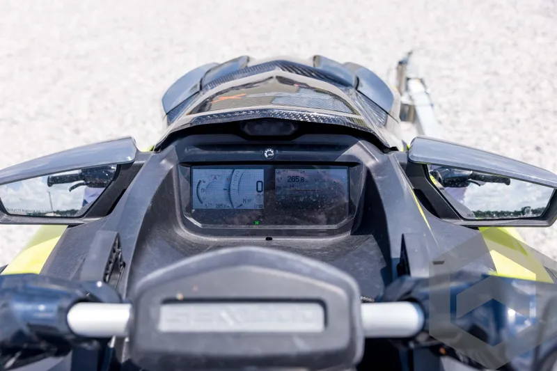 Slide: The Image of 2024 Sea-Doo RXP-X 325 dashboard with digital display and handlebars. - 31