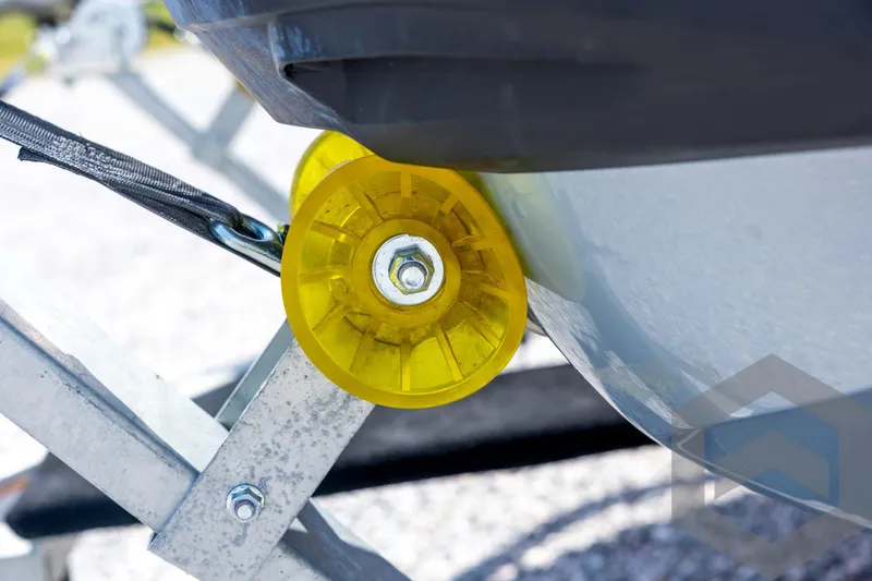 Slide: The Image of Close-up of 2024 Sea-Doo RXP-X 325 on trailer with yellow roller. - 34