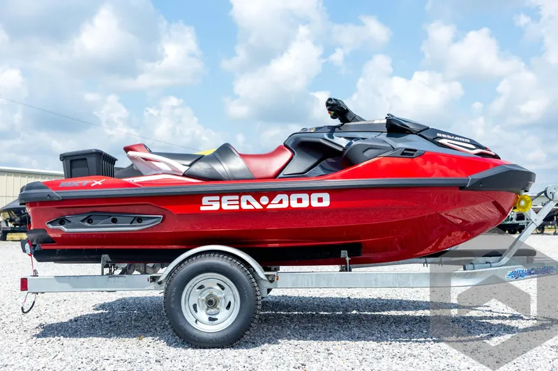 Slide: The Image of 2024 Sea-Doo RXP-X 325 jet ski on trailer, showcasing sleek design and vibrant colors. - 4