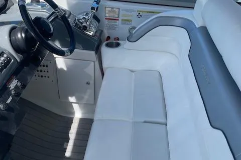 Slide: The Image of 2014 Formula 370 Super Sport boat interior with white seating and steering wheel. - 14