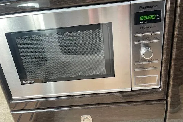 Slide: The Image of Panasonic microwave with digital display in a 2014 Formula 370 Super Sport boat kitchen. - 18