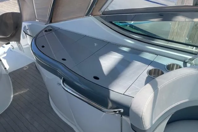 Slide: The Image of 2014 Formula 370 Super Sport boat interior with sleek seating and cup holders. - 2