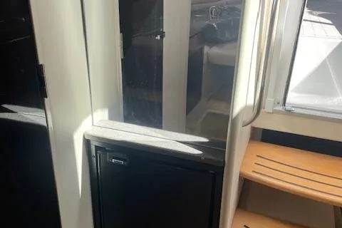 Slide: The Image of Interior of 2014 Formula 370 Super Sport boat with steps and cabinetry. - 20