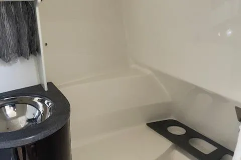 Slide: The Image of 2014 Formula 370 Super Sport interior with sink and seating area. - 22