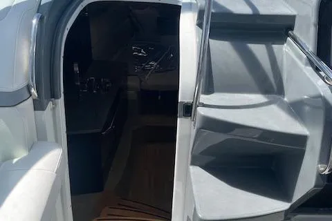 Slide: The Image of 2014 Formula 370 Super Sport boat interior with stairs and cabin entrance. - 23