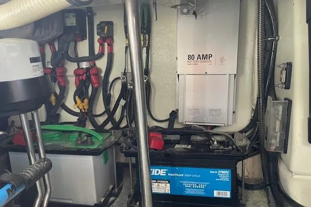 Slide: The Image of Engine room of a 2014 Formula 370 Super Sport with batteries and wiring. - 26