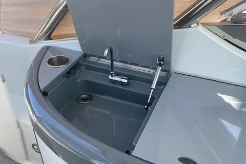 Slide: The Image of 2014 Formula 370 Super Sport yacht sink with faucet and cup holder. - 3