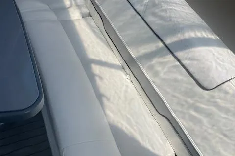 Slide: The Image of 2014 Formula 370 Super Sport boat interior with white seating and table. - 6