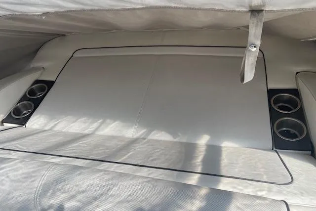 Slide: The Image of 2014 Formula 370 Super Sport boat interior with cup holders and covered seating area. - 7