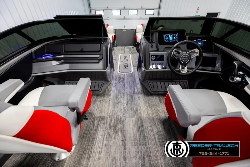 Slide: The Image of Interior of 2026 Avalon CAT CRBW boat with modern dashboard and red-gray seating. - 17